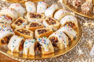 A holiday plate of Italian Fig Cookies with colorful sprinkles