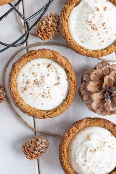 Eggnog Cheesecake Cookie Cups! Chewy gingerbread cookie cups filled with a fluffy eggnog cheesecake. | livforcake.com