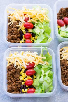 Meal Prep Taco Salad Lunch Bowls that you can make ahead! These easy taco salads are filled with taco beef, lettuce, cheese, black beans, corn and salsa! | www.kristineskitchenblog.com